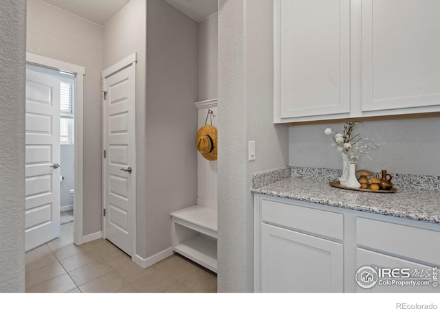 2332 Tabor St, Berthoud, CO 80513 - mudroom featuring light tile patterned floors and baseboards