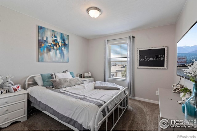 2332 Tabor St, Berthoud, CO 80513 - bedroom featuring dark carpet and baseboards