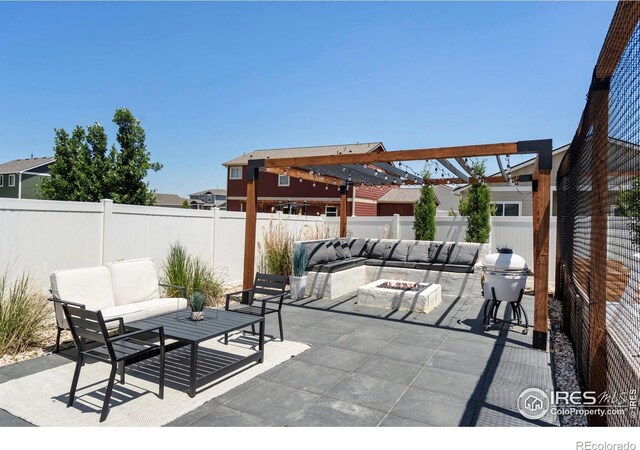 2332 Tabor St, Berthoud, CO 80513 - fenced backyard with an outdoor living space with a fire pit, a patio area, and grilling area