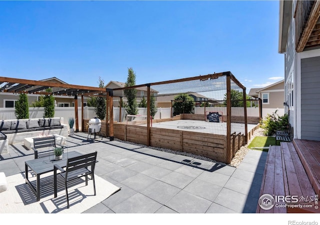 2332 Tabor St, Berthoud, CO 80513 - fenced backyard featuring an outdoor living space, a patio, and area for grilling