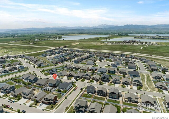2332 Tabor St, Berthoud, CO 80513 - aerial overview of property's location with a water and mountain view and nearby suburban area