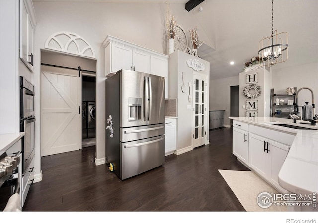 4041 Carroway Seed Dr, Johnstown, CO 80534 - kitchen featuring stainless steel refrigerator with ice dispenser, light countertops, dark wood-type flooring, white cabinetry, and recessed lighting