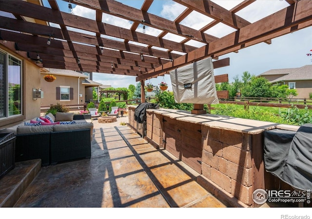 4041 Carroway Seed Dr, Johnstown, CO 80534 - view of patio featuring an outdoor living space with a fire pit, an outdoor kitchen, and a pergola