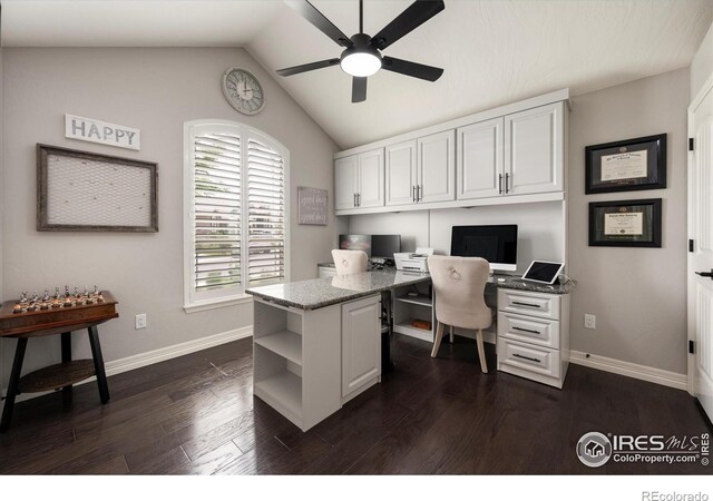 4041 Carroway Seed Dr, Johnstown, CO 80534 - office area with a ceiling fan, built in study area, vaulted ceiling, and dark wood-type flooring