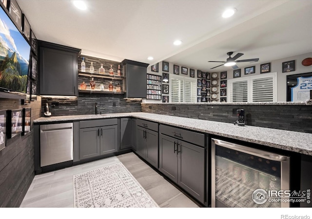 4041 Carroway Seed Dr, Johnstown, CO 80534 - indoor bar featuring beverage cooler, a ceiling fan, decorative backsplash, recessed lighting, and refrigerator