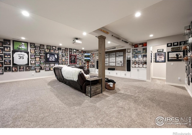 4041 Carroway Seed Dr, Johnstown, CO 80534 - living area featuring recessed lighting, carpet, decorative columns, and beamed ceiling