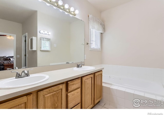 6544 Saddleback Ave, Longmont, CO 80504 - ensuite bathroom featuring double vanity and a bath