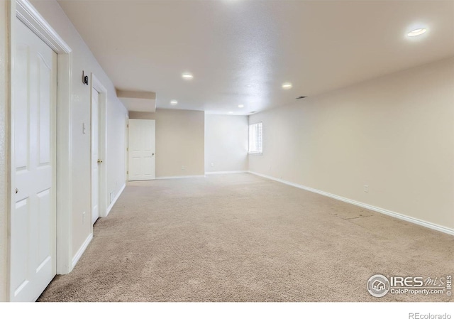 6544 Saddleback Ave, Longmont, CO 80504 - below grade area featuring recessed lighting and light colored carpet