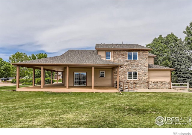 6544 Saddleback Ave, Longmont, CO 80504 - back of property with stone siding, a lawn, and a patio