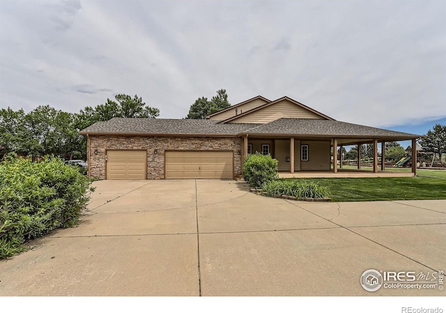 6544 Saddleback Ave, Longmont, CO 80504 - view of front facade with a garage, driveway, a porch, a shingled roof, and a front yard