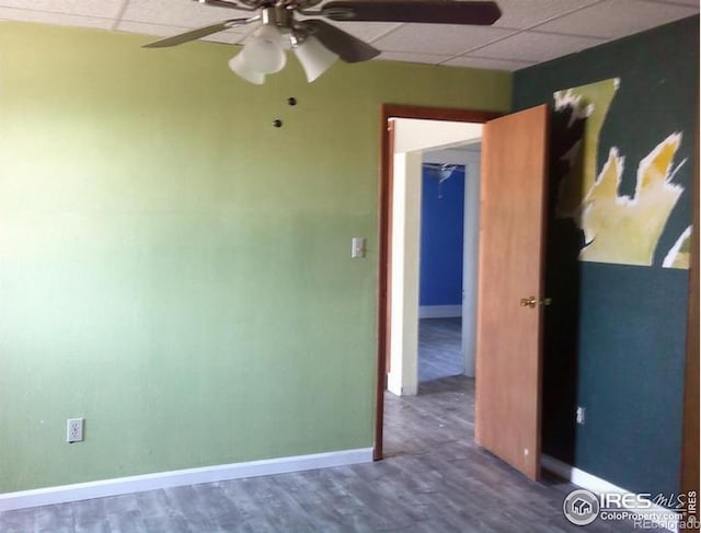 23243 Pawnee Ave, Padroni, CO 80745 - unfurnished room with a paneled ceiling, ceiling fan, and wood finished floors