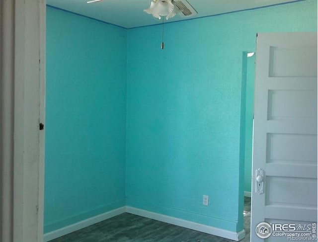 23243 Pawnee Ave, Padroni, CO 80745 - empty room with a ceiling fan and dark wood-type flooring