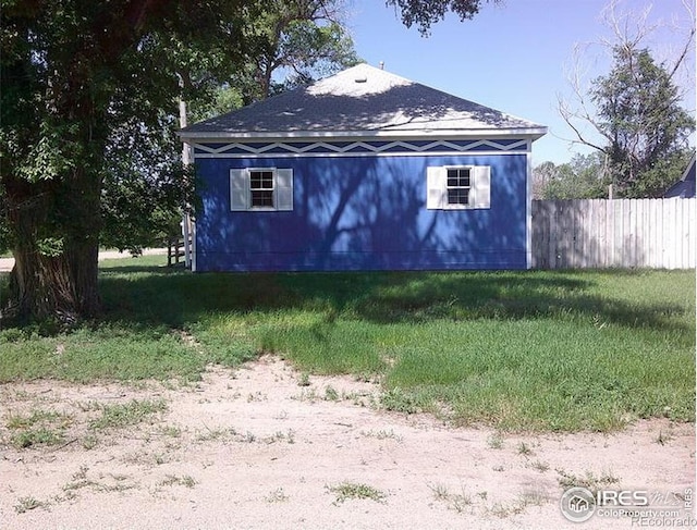 23243 Pawnee Ave, Padroni, CO 80745 - view of side of home featuring a shingled roof