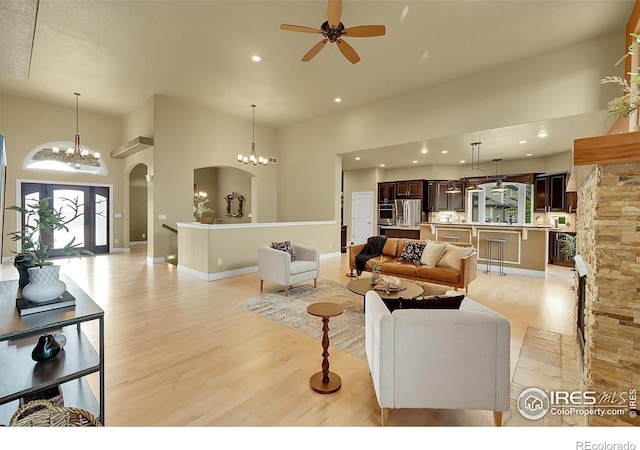 8406 Spinnaker Bay Dr, Windsor, CO 80528 - living area featuring healthy amount of natural light, light wood-type flooring, a high ceiling, and recessed lighting