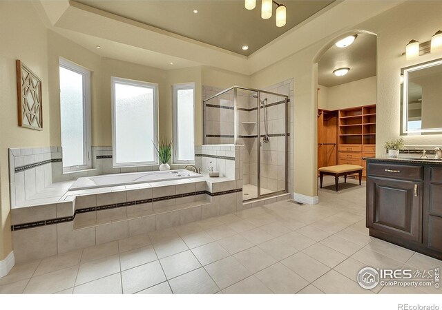 8406 Spinnaker Bay Dr, Windsor, CO 80528 - bathroom featuring a shower stall, a garden tub, vanity, tile patterned flooring, and recessed lighting