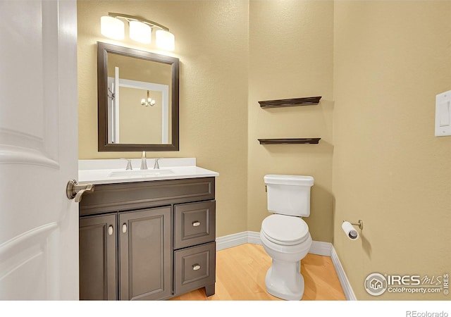 8406 Spinnaker Bay Dr, Windsor, CO 80528 - bathroom featuring vanity and wood finished floors