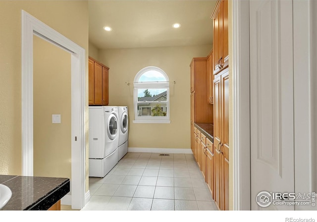 8406 Spinnaker Bay Dr, Windsor, CO 80528 - washroom with washer and dryer, cabinet space, recessed lighting, and light tile patterned floors