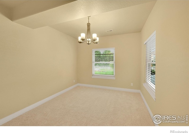 8406 Spinnaker Bay Dr, Windsor, CO 80528 - unfurnished room featuring a chandelier and light carpet