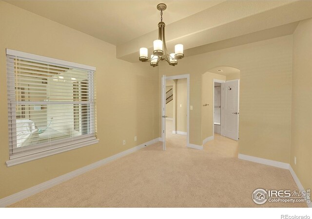 8406 Spinnaker Bay Dr, Windsor, CO 80528 - unfurnished room featuring carpet flooring, arched walkways, and a chandelier