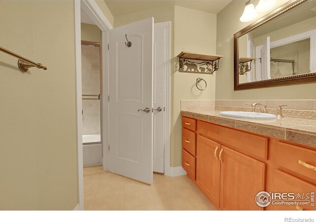 8406 Spinnaker Bay Dr, Windsor, CO 80528 - bathroom featuring vanity, tile patterned floors, and bathing tub / shower combination