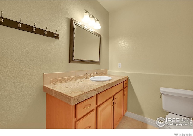 8406 Spinnaker Bay Dr, Windsor, CO 80528 - half bath featuring vanity and tile patterned flooring