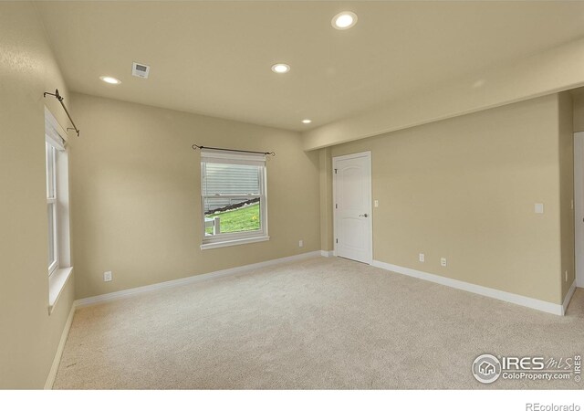 8406 Spinnaker Bay Dr, Windsor, CO 80528 - empty room with recessed lighting and light colored carpet