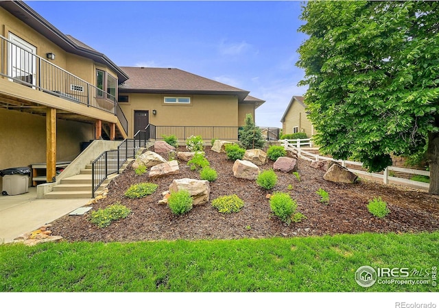 8406 Spinnaker Bay Dr, Windsor, CO 80528 - view of yard featuring stairs