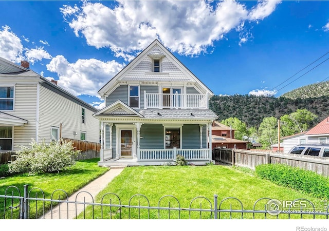 1906 Miner St, Idaho Springs, CO 80452 - victorian-style house featuring a porch and a balcony