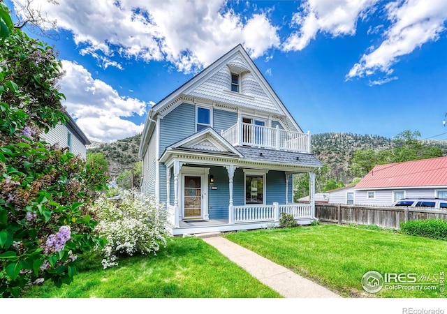 1906 Miner St, Idaho Springs, CO 80452 - victorian home with covered porch and a balcony