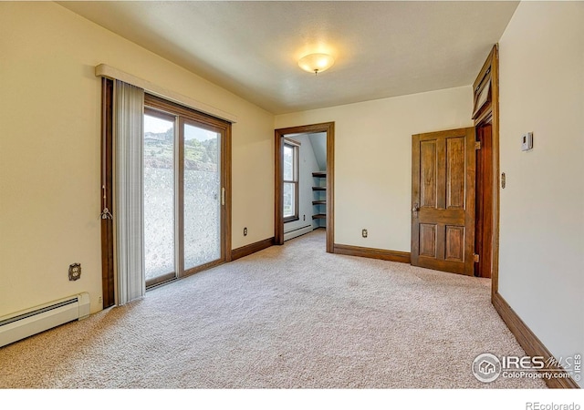 1906 Miner St, Idaho Springs, CO 80452 - empty room featuring a baseboard heating unit and carpet