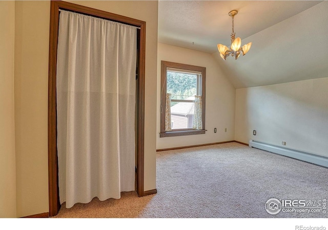 1906 Miner St, Idaho Springs, CO 80452 - additional living space with light carpet, a chandelier, lofted ceiling, and a baseboard radiator