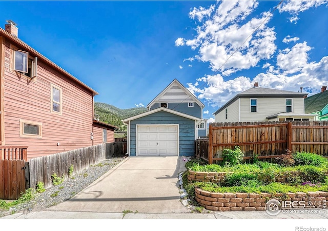 1906 Miner St, Idaho Springs, CO 80452 - detached garage with concrete driveway and a mountain view