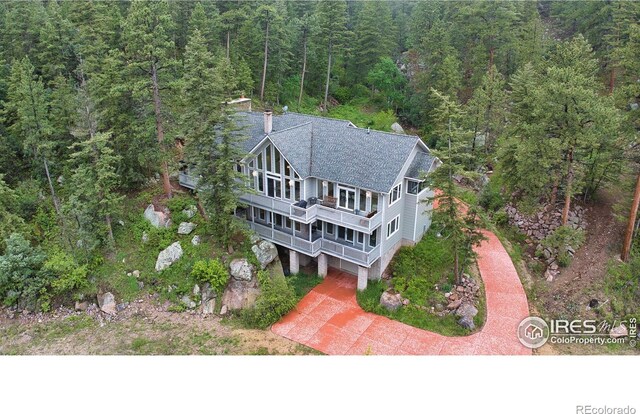 11042 N Saint Vrain Dr, Lyons, CO 80540 - aerial view of property and surrounding area with a heavily wooded area