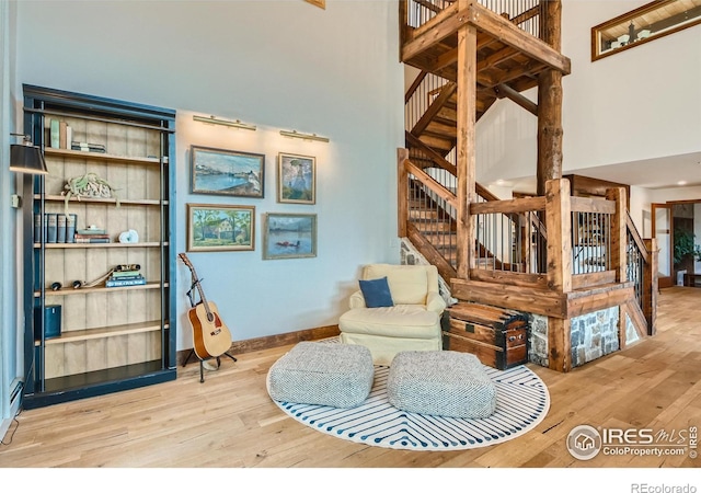 148 Granite Dr, Boulder, CO 80302 - living area with a high ceiling, hardwood / wood-style flooring, and stairs