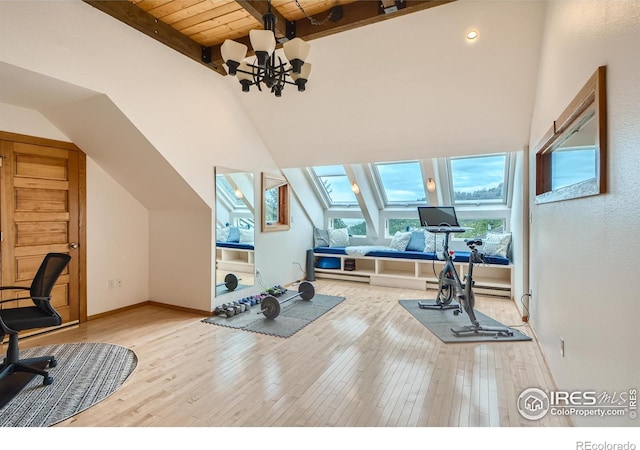 148 Granite Dr, Boulder, CO 80302 - workout room featuring a chandelier, hardwood / wood-style floors, wood ceiling, a skylight, and lofted ceiling