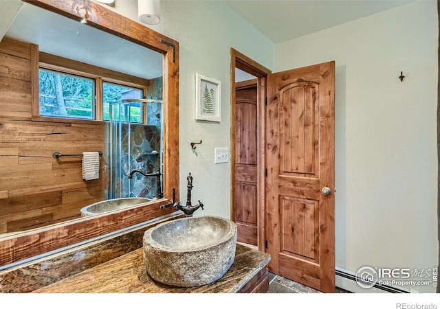 148 Granite Dr, Boulder, CO 80302 - bathroom featuring a stall shower, vanity, and a baseboard heating unit