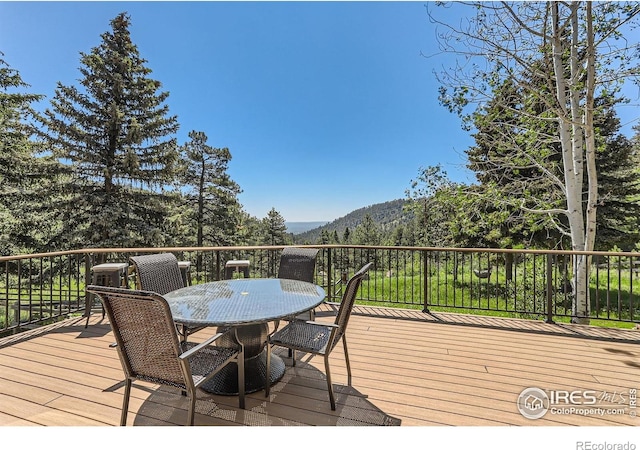 148 Granite Dr, Boulder, CO 80302 - wooden terrace with a mountain view and outdoor dining area