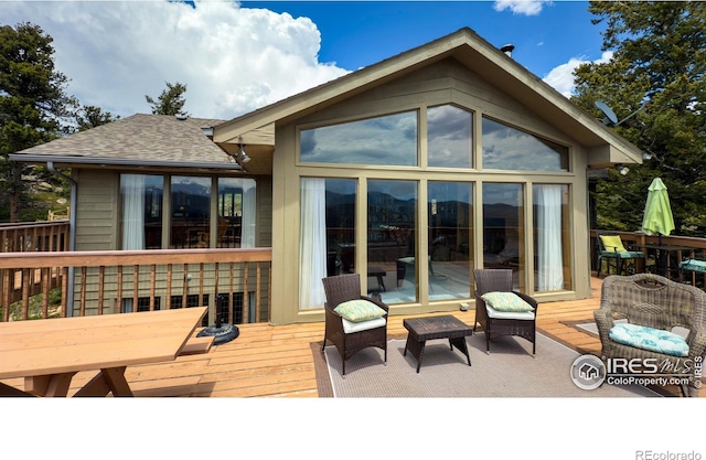 118 Alpine Dr, Estes Park, CO 80517 - back of house with a deck, a sunroom, and roof with shingles