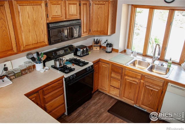 118 Alpine Dr, Estes Park, CO 80517 - kitchen with black microwave, gas range, white dishwasher, light countertops, and healthy amount of natural light