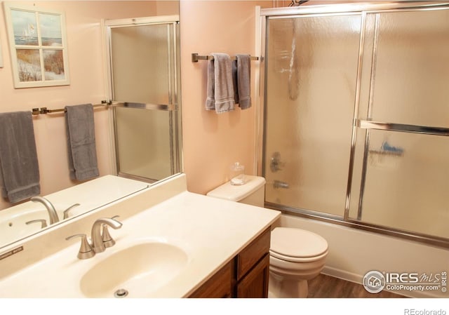 118 Alpine Dr, Estes Park, CO 80517 - full bath featuring vanity, bath / shower combo with glass door, and wood finished floors