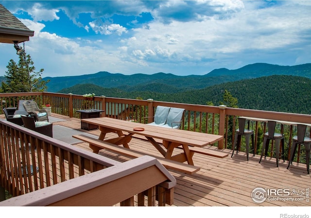 118 Alpine Dr, Estes Park, CO 80517 - wooden deck featuring a mountain view and outdoor dining area