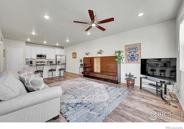 551 Vicot Way Unit D, Fort Collins, CO 80524 - living room with ceiling fan, recessed lighting, and light wood finished floors