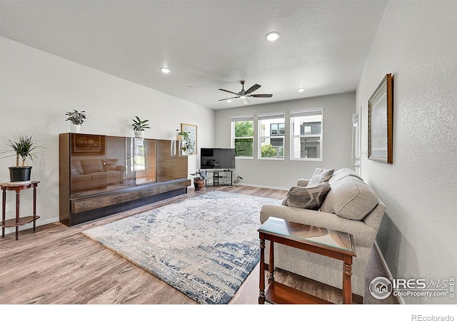 551 Vicot Way Unit D, Fort Collins, CO 80524 - living room featuring wood finished floors, a ceiling fan, and recessed lighting