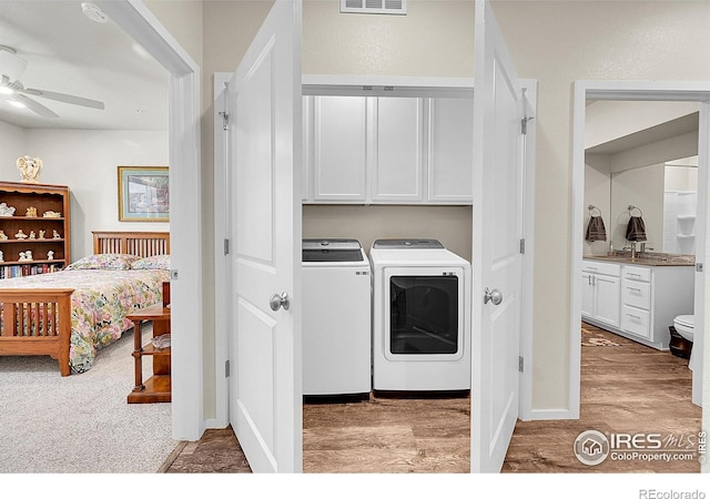 551 Vicot Way Unit D, Fort Collins, CO 80524 - washroom with independent washer and dryer, a ceiling fan, cabinet space, and light wood-style floors