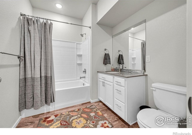 551 Vicot Way Unit D, Fort Collins, CO 80524 - bathroom featuring shower / bath combo with shower curtain, vanity, and recessed lighting