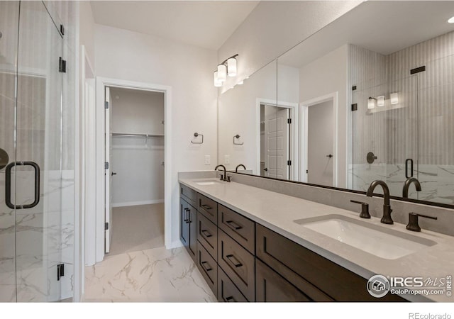 362 Promenade Dr, Superior, CO 80027 - full bath with marble look tile flooring, double vanity, a marble finish shower, and a spacious closet