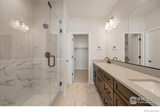 362 Promenade Dr, Superior, CO 80027 - full bathroom with marble look tiles, a marble finish shower, a walk in closet, and double vanity