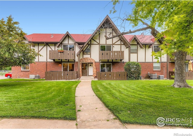 3250 Oneal Cir Unit 10, Boulder, CO 80301 - tudor-style house with stucco siding, brick siding, and a front yard