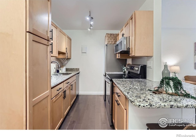 3250 Oneal Cir Unit 10, Boulder, CO 80301 - kitchen featuring stainless steel appliances, dark wood-type flooring, light stone countertops, and light brown cabinetry