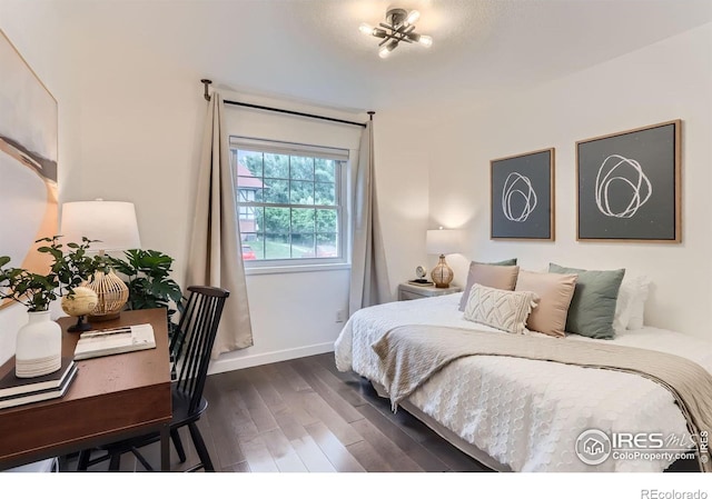 3250 Oneal Cir Unit 10, Boulder, CO 80301 - bedroom with dark wood-style floors and baseboards